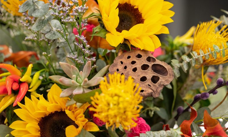 A floral arrangement featuring bright sunflowers.