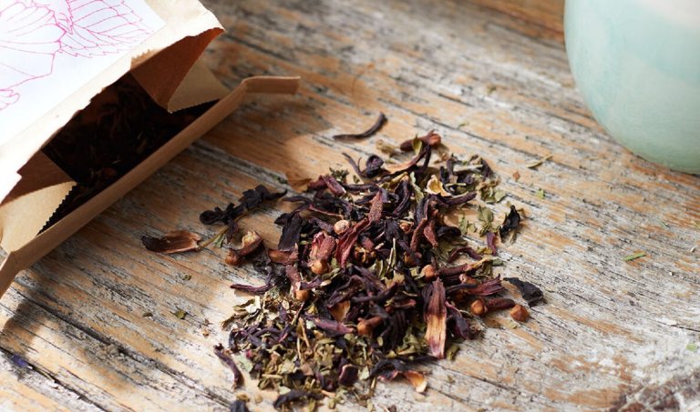 Loose leaf tea on a wood table.