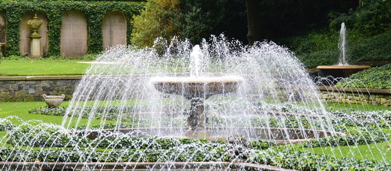 view of the italian water garden fountain with water spraying