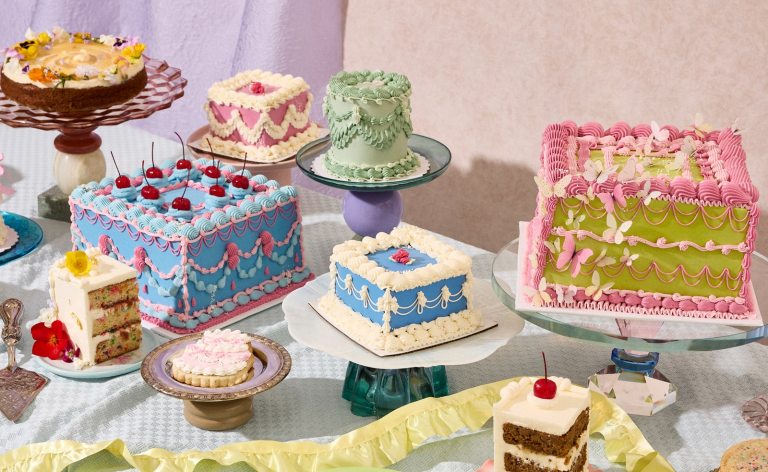 A variety of vintage style cakes decorated and on display.