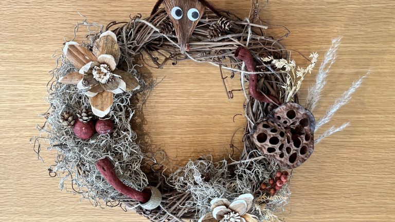 Grapevine wreath decorated with natural materials