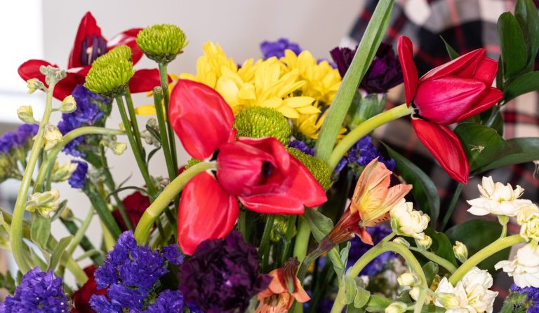 The top of an arrangement of vividly colored flowers. 