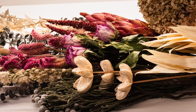 A variety of dried floral material in a range of colors. 