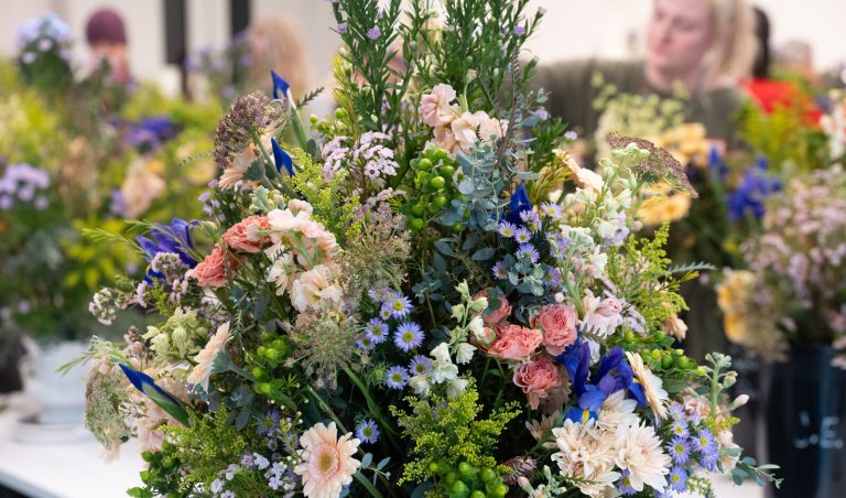 A large scale floral design featuring blue and white blooms.