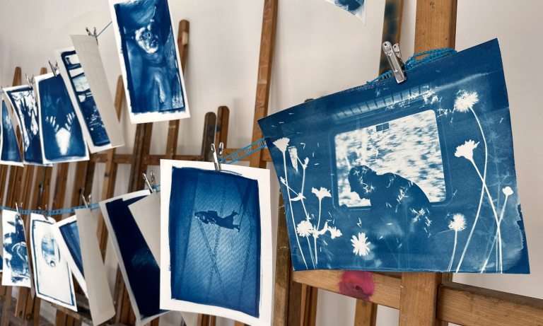 A display of cyantopes hanging against easels. 