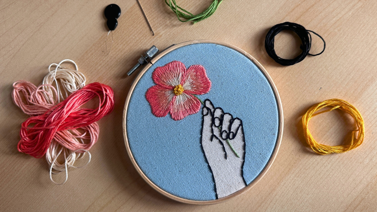 Embroidery by Lea Saccomanno including a hoop and embroidery thread.
