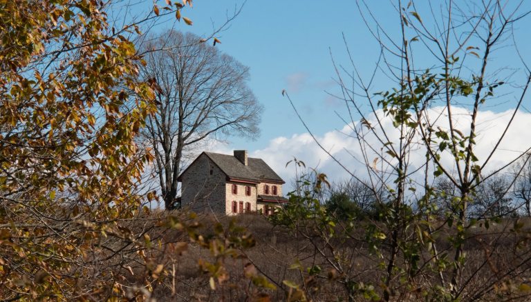 A vista of the Webb Farm House in the Meadow Garden.