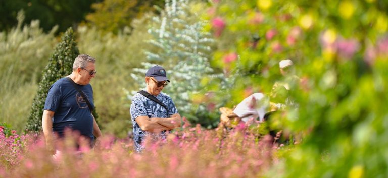 Two people in a garden.