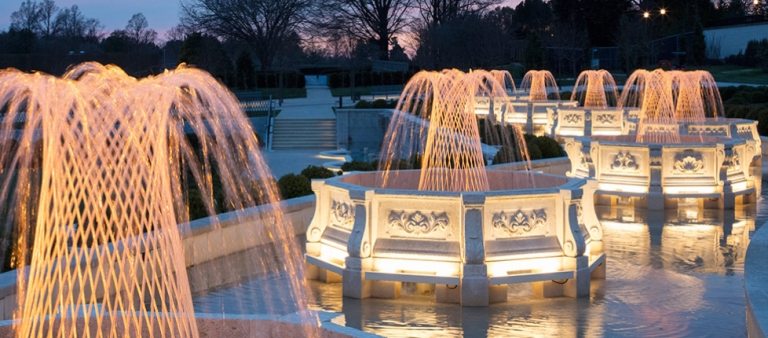 lit fountains at dusk