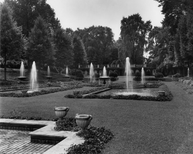 A wide shot showed a garden filled with small fountain pools in a white and black photo