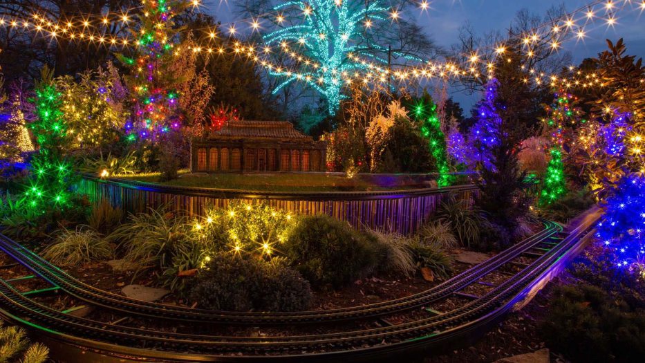 a garden railway lit for Christmas
