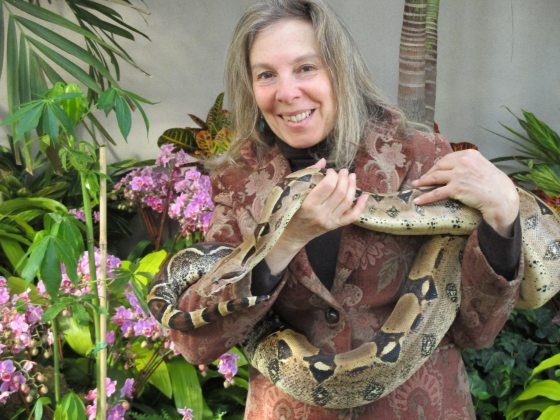 Lynne Cherry with a snake wrapped around her neck 