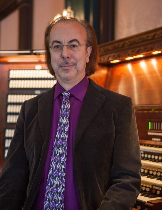 a person in front of an organ