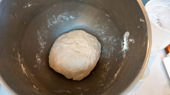 ball of dough in a gray bowl