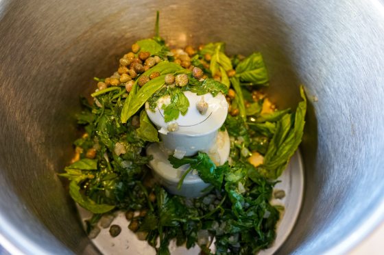 capers, basil, and parsley in a food processor