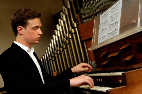 musician playing the organ