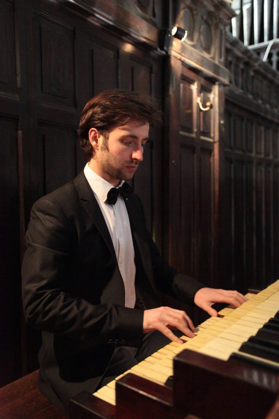 portrait of musician playing the organ