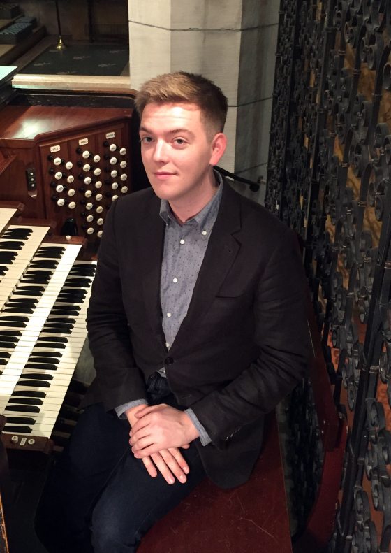 portrait of musician seated at organ console