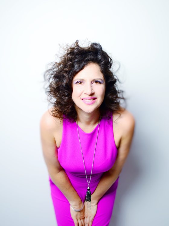 Portrait of a performer, leaning in toward the camera