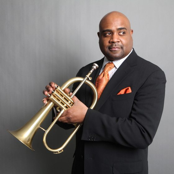 portrait of performer holding a trumpet