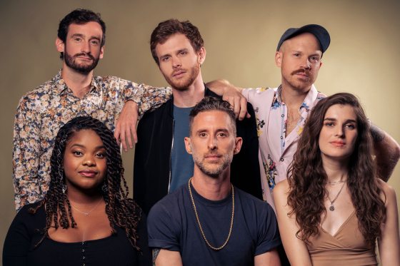 Portrait of 6 musicians looking into the camera