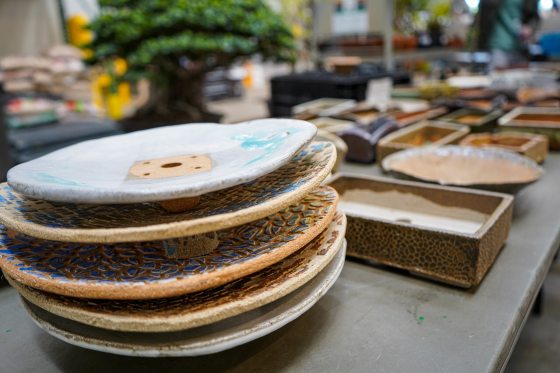 A stack of plates used in planting kusamono plants. 