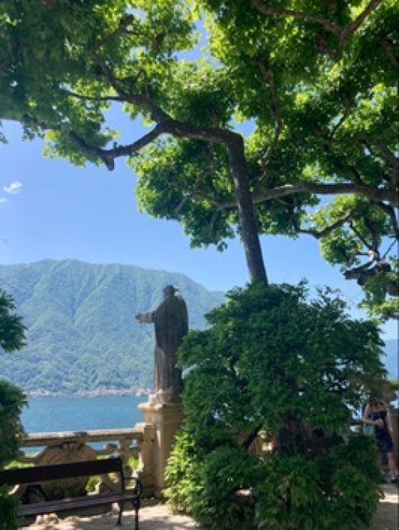 Trees framing the vewi of a lake in Italy.