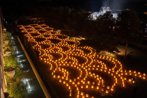 Luminaries lit in a pattern in the Main Fountain Garden at Longwood.