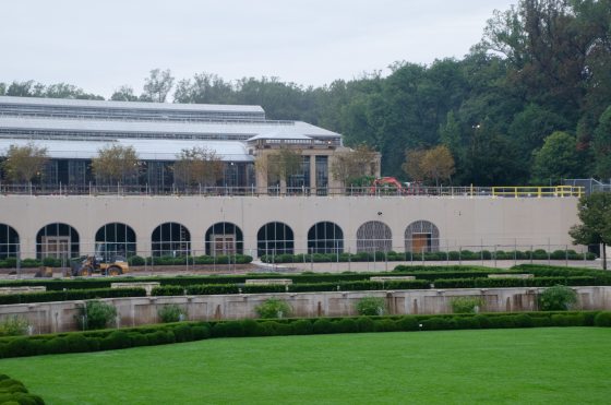 The facade of the Longwood Conservatory under construction.