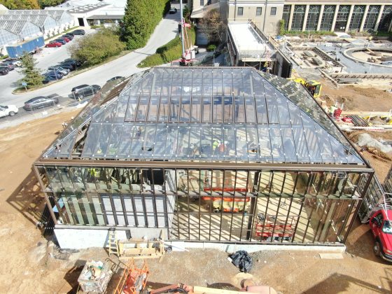 A glass conservatory being constructed. 