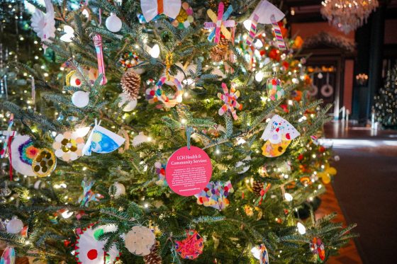 A close up image of a Christmas tree decorated by ornaments made by children.