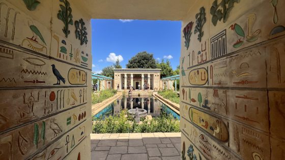 An garden with an ancient Egyptian theme, incorporating hierogyphics on the walls.