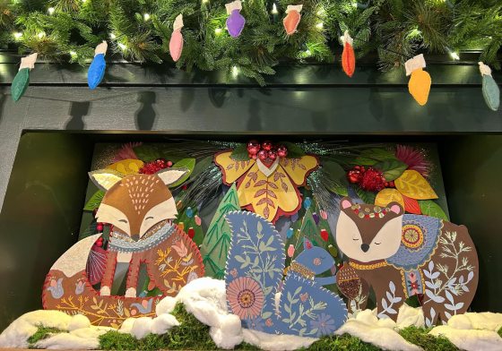 Colorful woodland animals in a cozy winter wonderland made out of paper..