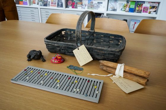 A variety of items from the Longwood Archives displayed on a table.