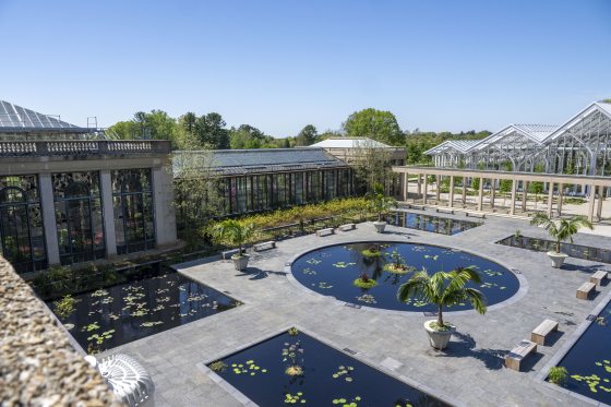An aerial view of the waterlily court at Longwood Gardens, featuring 6 pools filled ith different varieties of waterlilies. 