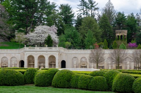 The Main Fountain Garden at Longwood featuring rows of boxwood shrubs in a spring landscape.