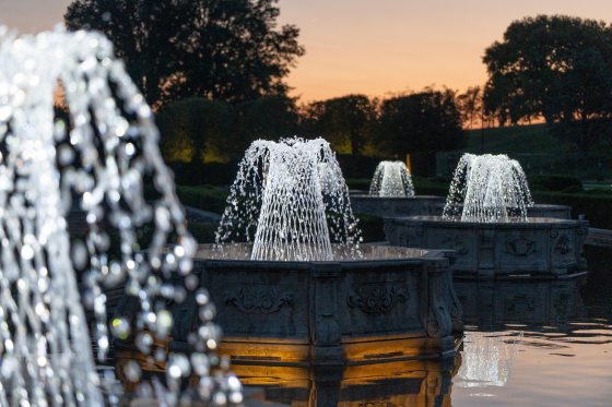 Basket weave fountains on display at Longwood Gardens at dusk.
