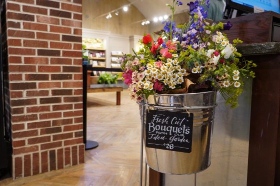 Bouquets of flowers in a steel bucket for sale outside the Longwood Gardens Shop.