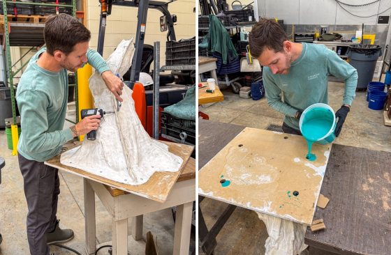 Kevin uses a power drill and a utility knife to work on a white plaster "mother mold" that encases the silicone mold and sculpture form. Then, pours bright teal liquid silicone into a wooden mold frame on a workshop table to create a flexible mold of the sculpture.