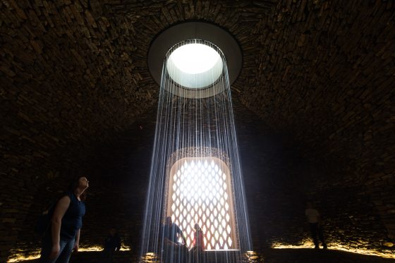 image of the grotto's fountain underground behind the Pumphouse Facade