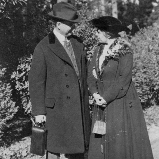 black and white photo of Mr and Mrs du Pont walking outside