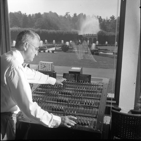 A person at the control panel of the Main Fountain Garden