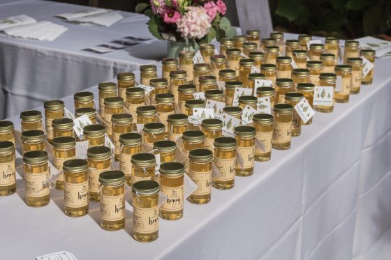 a table displaying multiple jars of honey 