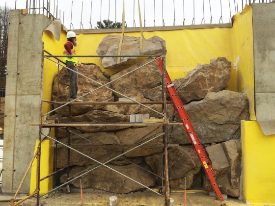 boulders being stacked and installed for the grotto